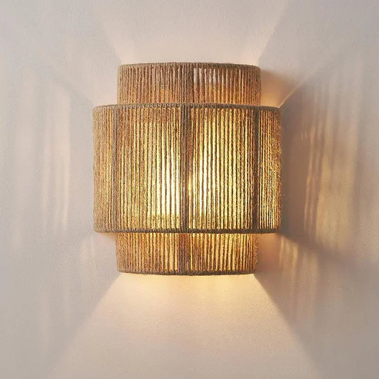 Hand-woven LED wall lamp.